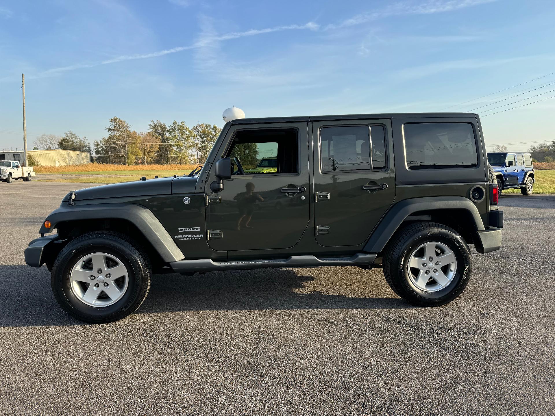 Used 2015 Jeep Wrangler Unlimited Sport with VIN 1C4BJWDG1FL774491 for sale in Salem, IL