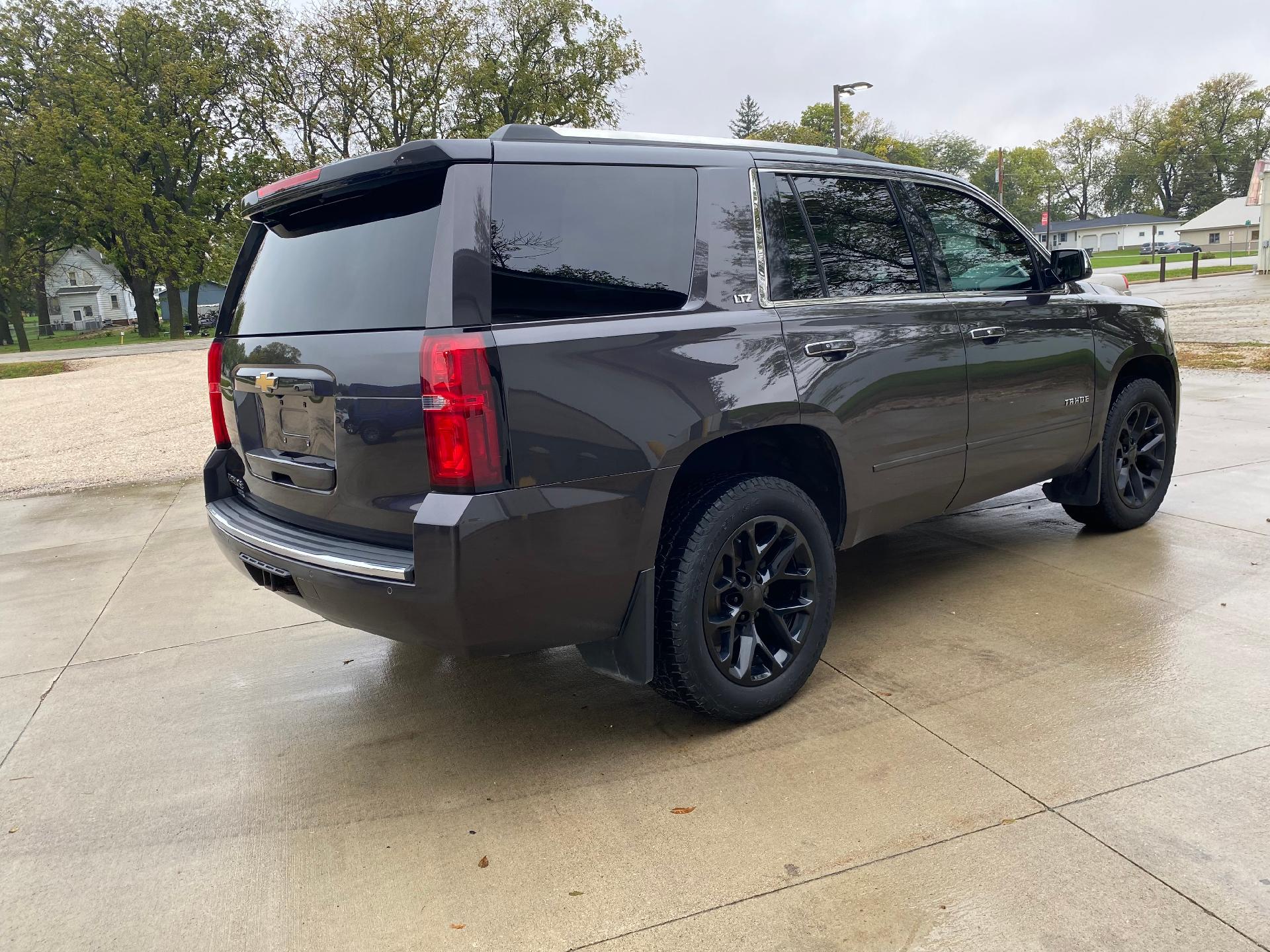 Used 2015 Chevrolet Tahoe LTZ with VIN 1GNSKCKC9FR123741 for sale in West Bend, IA