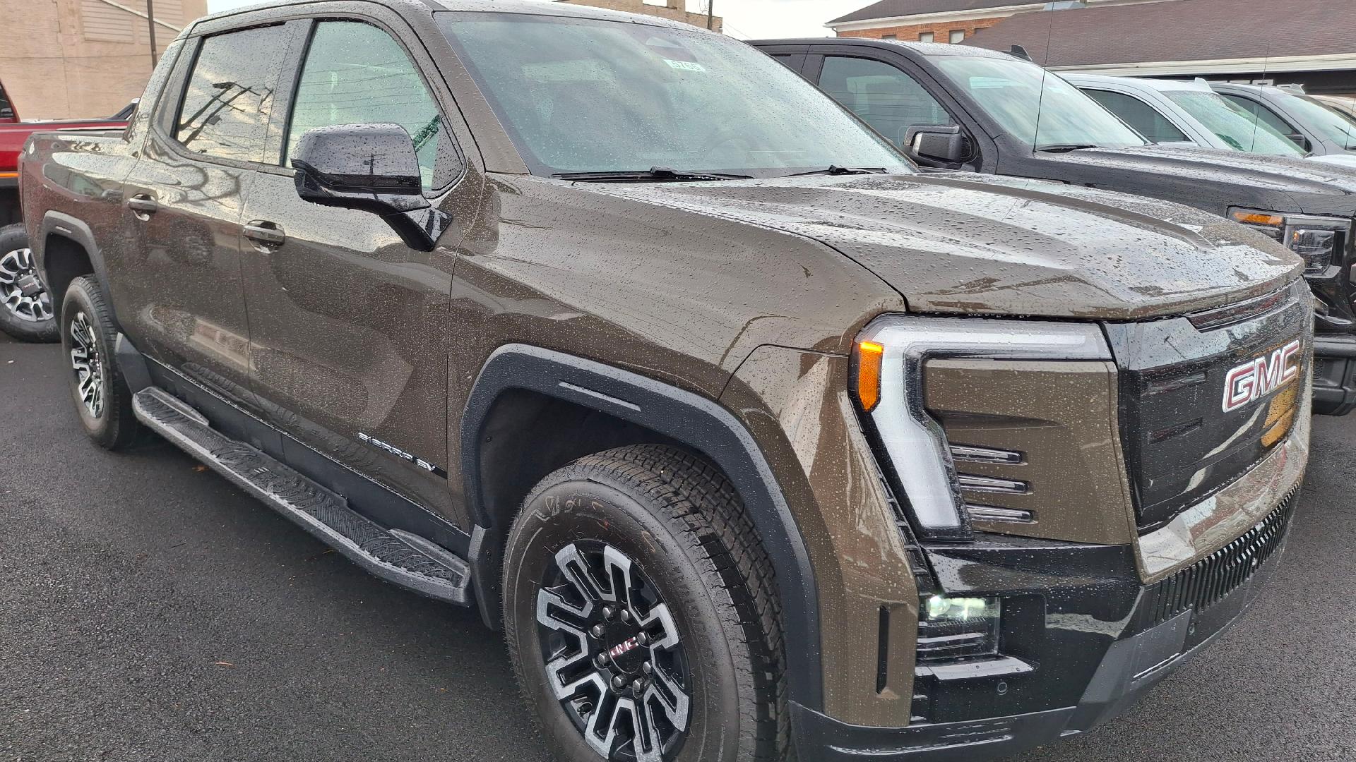 Deep Bronze Metallic 2026 GMC Sierra EV Elevation Crew Cab (Standard Range) e4WD Pickup Truck All-Wheel Drive 1-Speed Automatic