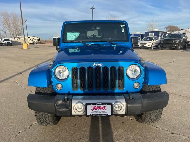 Used 2015 Jeep Wrangler Unlimited Sahara with VIN 1C4HJWEG1FL527173 for sale in Lennox, SD