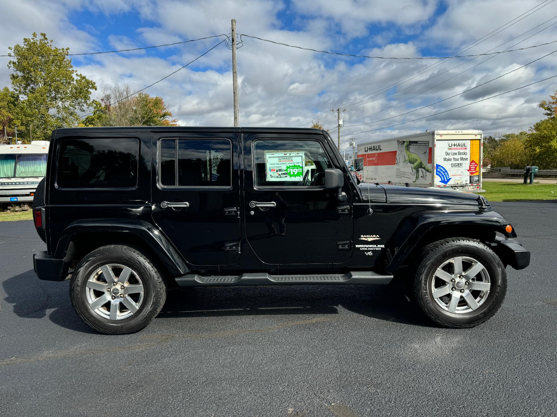 Used 2013 Jeep Wrangler Unlimited Sahara with VIN 1C4BJWEGXDL594700 for sale in Bridgman, MI