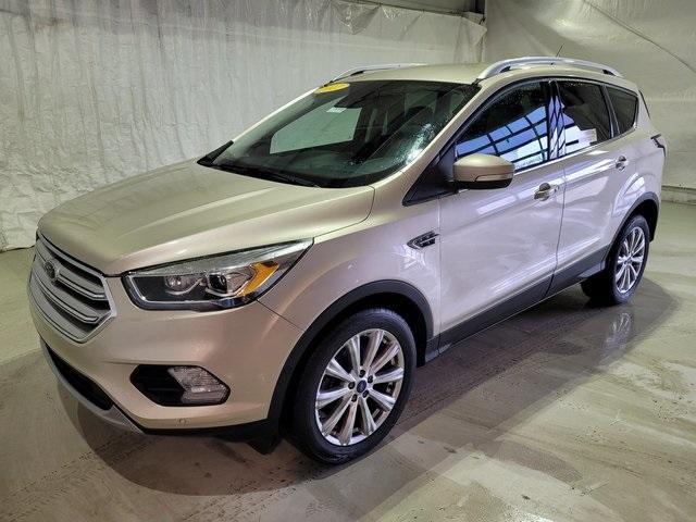 Used 2017 Ford Escape Titanium with VIN 1FMCU0JD6HUF05754 for sale in Pinconning, MI