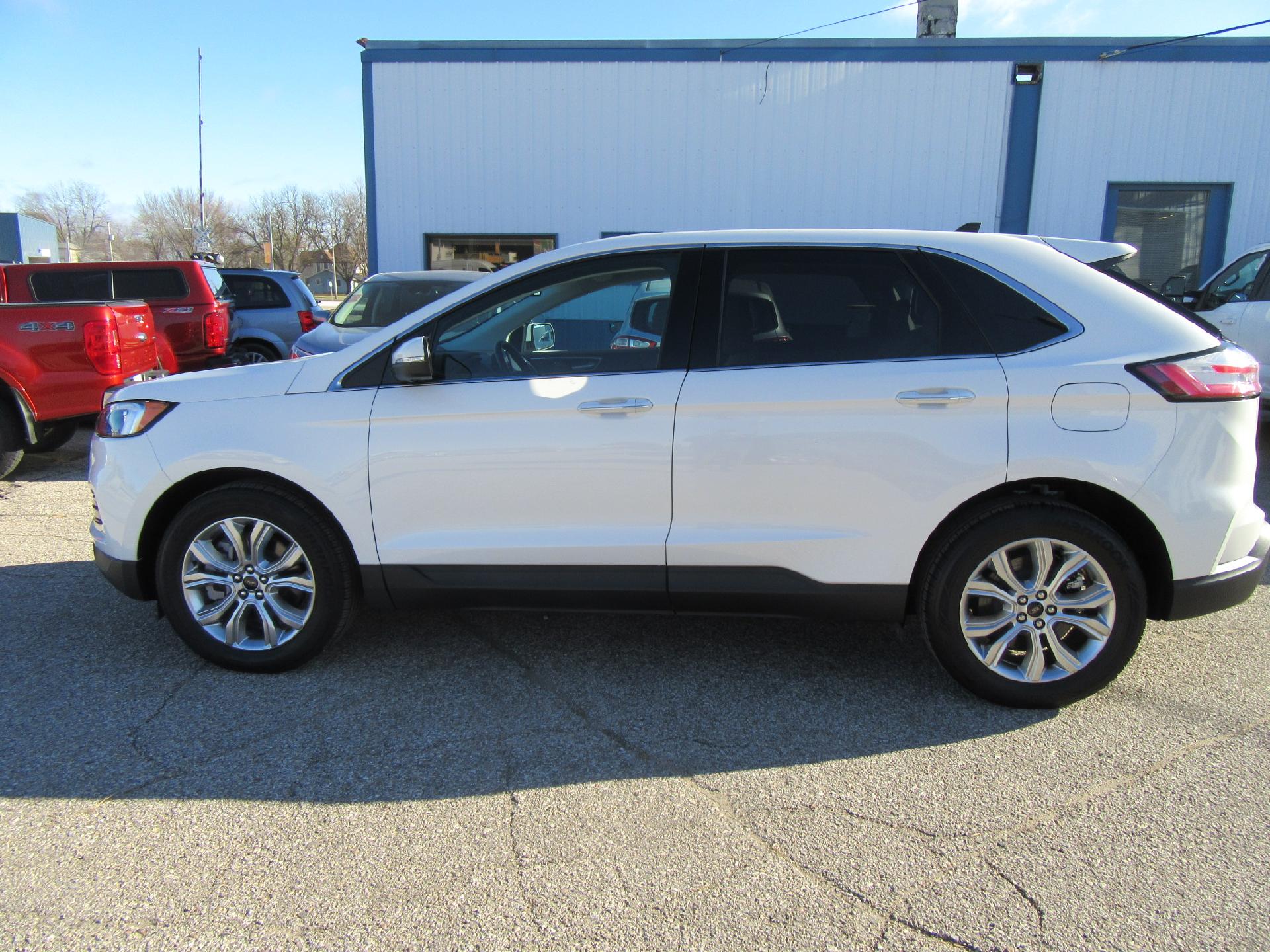 Used 2023 Ford Edge Titanium with VIN 2FMPK4K93PBA06097 for sale in Emmetsburg, IA