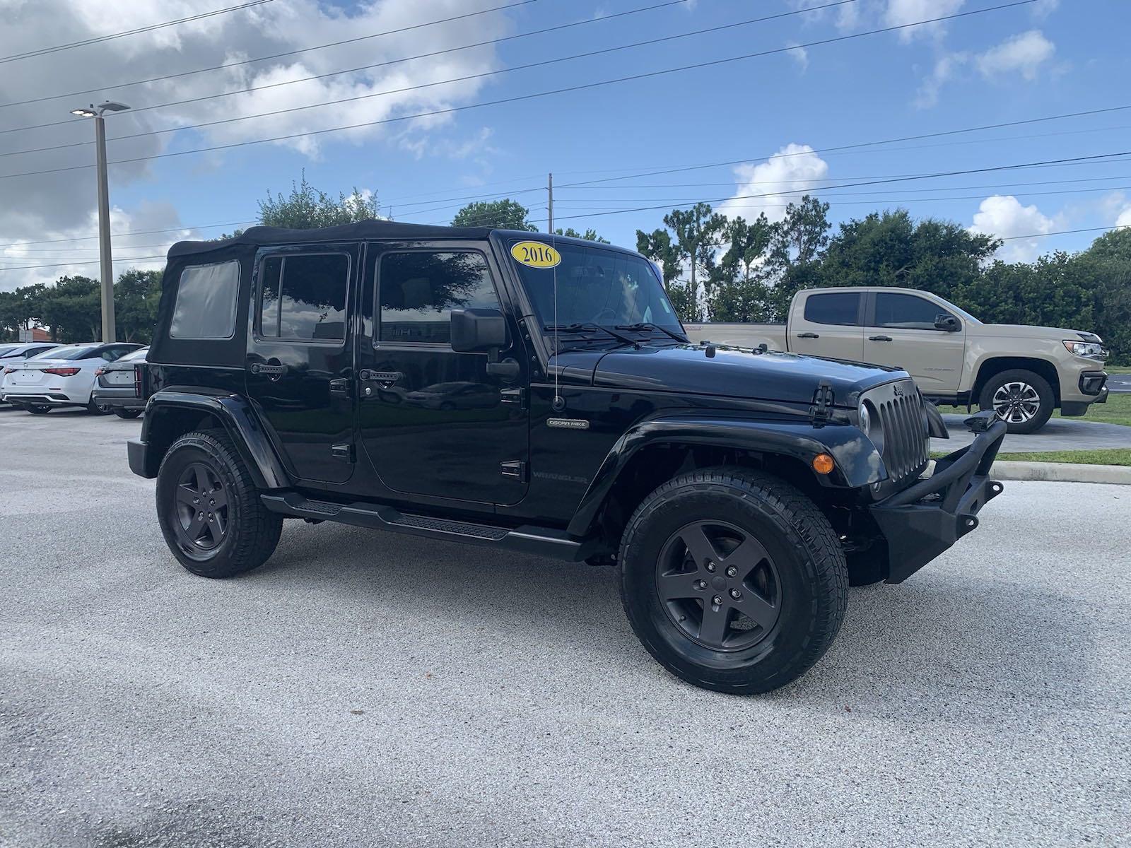 Used 2016 Jeep Wrangler Unlimited Freedom Edition with VIN 1C4BJWDG8GL210855 for sale in Winter Haven, FL