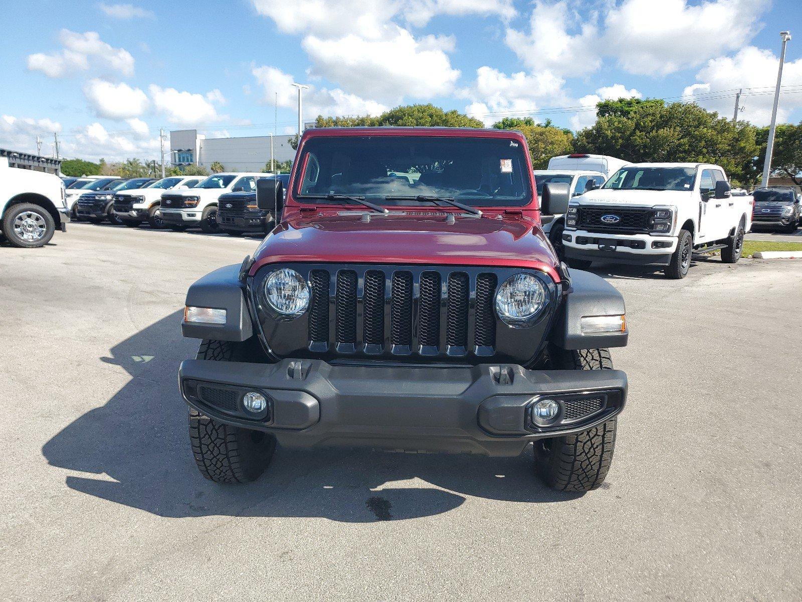 Used 2022 Jeep Wrangler Unlimited Willys Sport with VIN 1C4HJXDN2NW167334 for sale in Homestead, FL